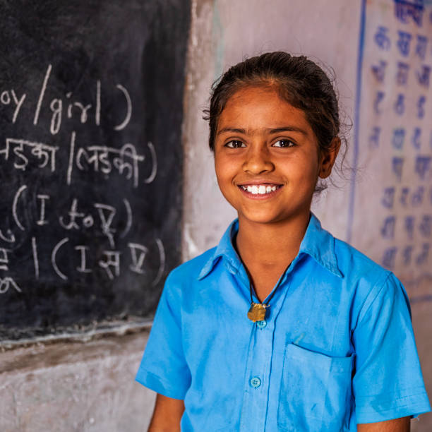 Indian schoolgirl in classroom, English language class, Rajasthan, India Indian schoolgirl in classroom, English language class, Rajasthan, India